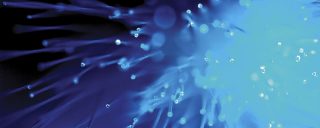 Close-up of bright blue, lit optical fibers